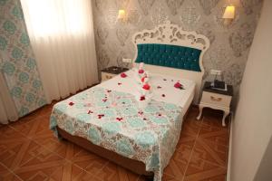 Postel nebo postele na pokoji v ubytování Turk Hotel