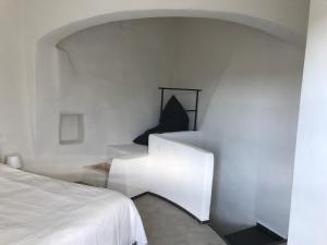Łóżko lub łóżka w pokoju w obiekcie Casa Vacanze Arma delle Manie