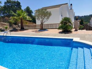 The swimming pool at or close to Bright Villa in Vidreres with Private Pool and Jacuzzi