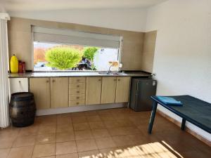 A kitchen or kitchenette at Bright Villa in Vidreres with Private Pool and Jacuzzi