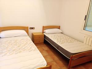 A bed or beds in a room at Bright Villa in Vidreres with Private Pool and Jacuzzi