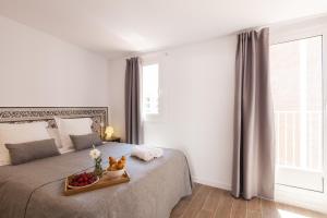 מיטה או מיטות בחדר ב-Charming Flats by Aspasios