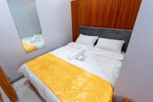 Postel nebo postele na pokoji v ubytování Grand Mercy Hotel + 9 fotografií