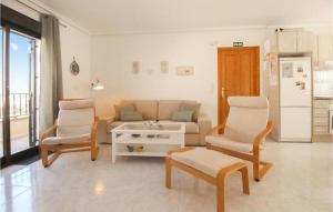 a living room with a couch and two chairs at 2 Bedroom Stunning Apartment In Rojales in Rojales