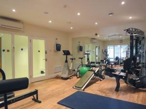 a gym with several treadmills and exercise bikes at 4 Burgh Island Causeway in Kingsbridge