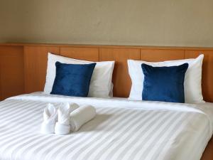 Voodi või voodid majutusasutuse Blue Palm Kata Resort toas