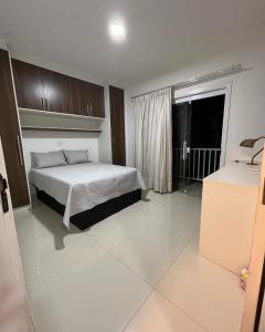 a bedroom with a bed and a window in it at CasaparkIndaiatuba in Indaiatuba +14 photos