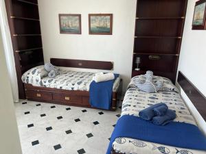 Un pat sau paturi într-o cameră la Sogno sul mare