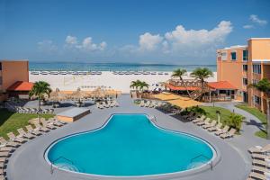 an aerial view of a resort with a swimming pool and the beach at Dolphin Beach Resort in St Pete Beach