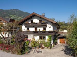 a house with a bike parked in front of it at Haus Sabine Braunegger in Kaltenbach