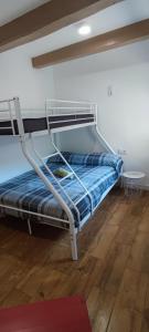 a bunk bed sitting inside of a room with at La Bombonera del Berguedà in Sant Jordi de Cercs