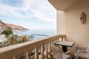 a balcony with a view of the ocean at Hotel Portomagno by ALEGRIA in Aguadulce