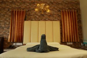 Voodi või voodid majutusasutuse MM Resorts toas
