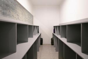 a locker room with black cabinets and a hallway at Hotel Best Andorra Center in Andorra la Vella