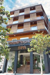 a building with a sign on the front of it at ALEGRIA Plaza Paris 4*Sup in Lloret de Mar
