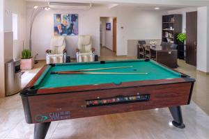 a pool table in the middle of a room at Hotel Moremar by ALEGRIA in Lloret de Mar