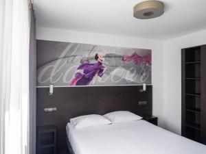 Łóżko lub łóżka w pokoju w obiekcie B&B HOTEL Bytom