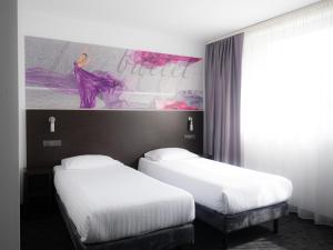 Postel nebo postele na pokoji v ubytování B&B HOTEL Bytom