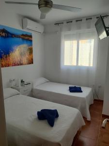 Cama o camas de una habitación en Apartamento El Flamenco Azul Cabo de Gata