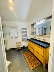 a bathroom with a sink and a mirror at Villa Kogayon in Le Bar-sur-Loup