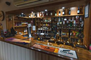 a bar with a lot of bottles of alcohol at Eyre arms 