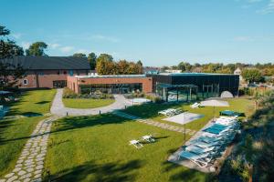 an aerial view of a building with a group of lounges at Domaine des Thermes in Awans