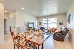 a dining room and living room with a table and chairs at Modern Livingston Condo Near Yellowstone River! in Livingston