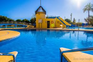 Piscina en o cerca de 426 Estudio en Minerva Apartamentos - Vista al jardín - Piscina y Playa