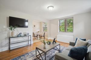 a living room with a couch and a table at Peaceful & Perfect Private 1-br I Lennox in Philadelphia