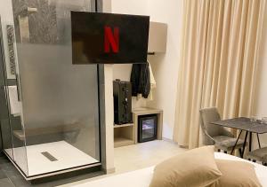 TV a/nebo společenská místnost v ubytování Olympus Capua