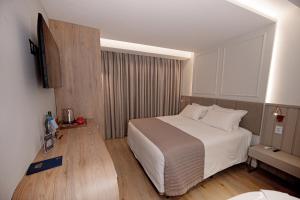 Ένα ή περισσότερα κρεβάτια σε δωμάτιο στο Hotel Marimar The Place +127 φωτογραφίες