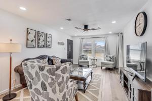 a living room with a couch and a table at Corpus Christi Charm in Corpus Christi