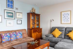 a living room with two couches and a coffee table at BEACH VIEW - Amazing Sea Views in Lytham St Annes