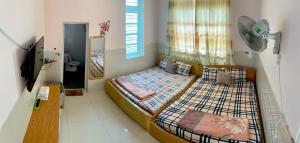 Giường trong phòng chung tại Homestay VT
