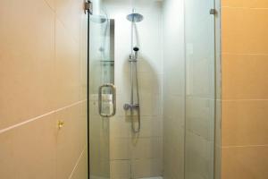 a bathroom with a shower with a glass door at BBHomes at Casa Residency KL in Kuala Lumpur +74 photos