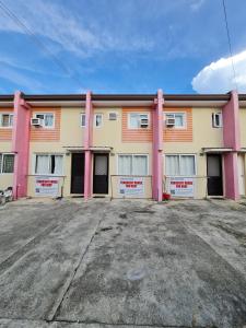 an empty parking lot in front of a building at Vacation Transient Guest House Rental Calapan City L43 in Calapan