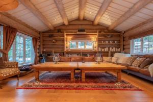 a living room with a wooden table in a house at Chalet De Luxe 518 in Trysil