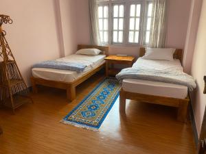 Postel nebo postele na pokoji v ubytování Himalayan Vacation Home