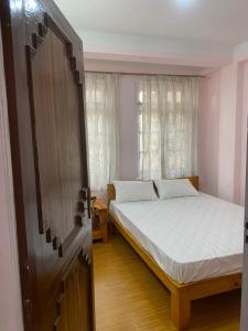 Postel nebo postele na pokoji v ubytování Himalayan Vacation Home
