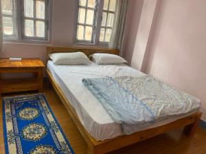 Postel nebo postele na pokoji v ubytování Himalayan Vacation Home