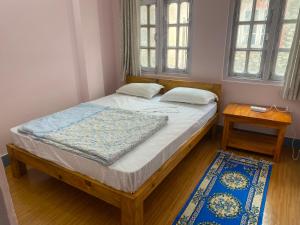 Postel nebo postele na pokoji v ubytování Himalayan Vacation Home