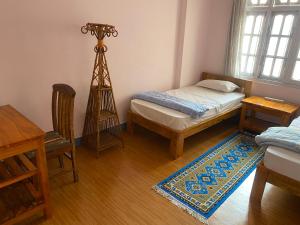 Postel nebo postele na pokoji v ubytování Himalayan Vacation Home