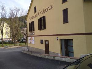 a building on the side of a street at Studio apartman Gašparić - središte do bolnice in Krapinske Toplice +4 photos