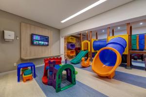 a play room with a bunch of play equipment at Monte Pascoal Praia Hotel Salvador in Salvador