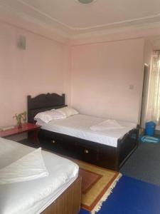 Postel nebo postele na pokoji v ubytování Himalayan Vacation Home