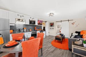 a kitchen and living room with a table and chairs at Desert Serenity in Yucca/Joshua Tree w/AC & Fire pit in Yucca Valley