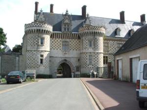 a large stone building with a gate in front of it at Studio Vue Loir, Centre-Ville in Bonneval