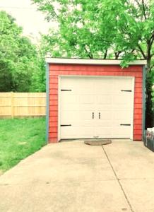 a red and white garage with a white door at *All-American Home Minutes From Case/UH/Cle Clinic in Cleveland Heights