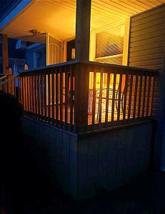 a front porch of a house at night at *All-American Home Minutes From Case/UH/Cle Clinic in Cleveland Heights