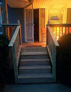 a set of stairs leading to a house with a door at *All-American Home Minutes From Case/UH/Cle Clinic in Cleveland Heights